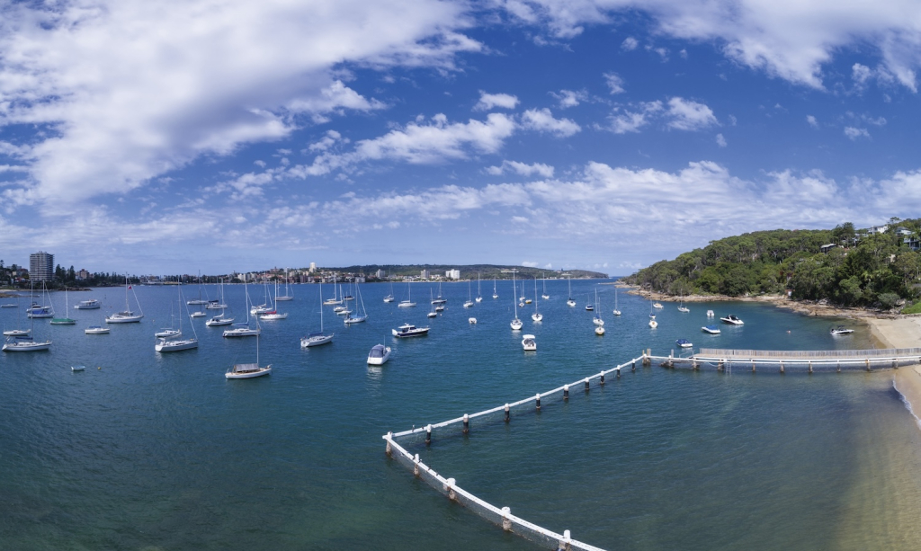 Scenic coastal aerial view across Sydney Harbour from Forty Baskets Beach