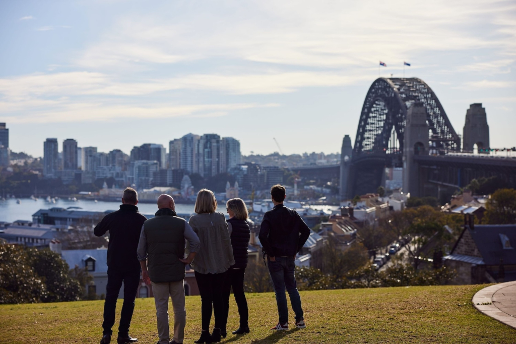 Group of people on Millers Point, Sydney watching the view of the Harbour Bridge and Sydney Skyline